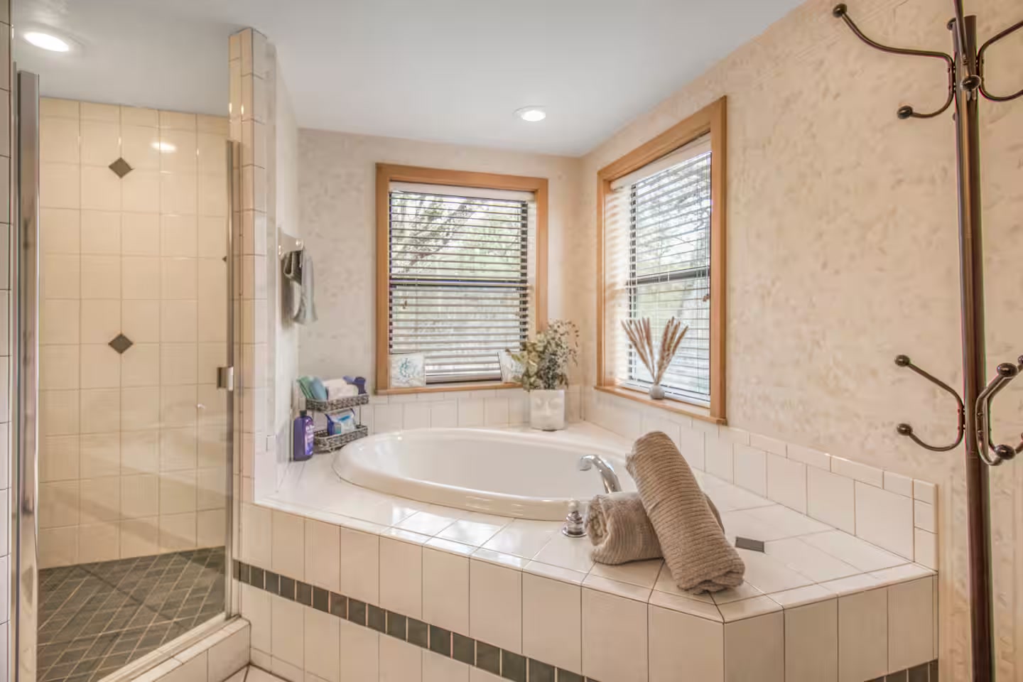 Private bathroom with garden tub and separate shower